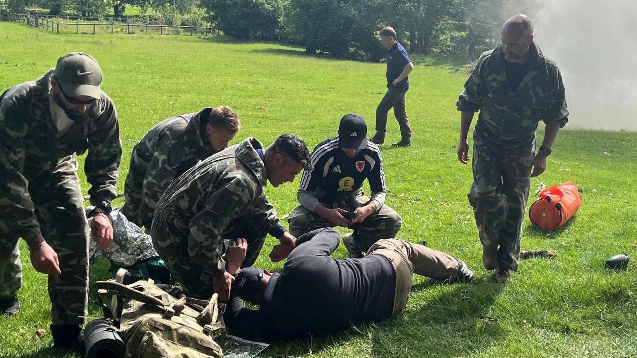 Coaches in military exercise
