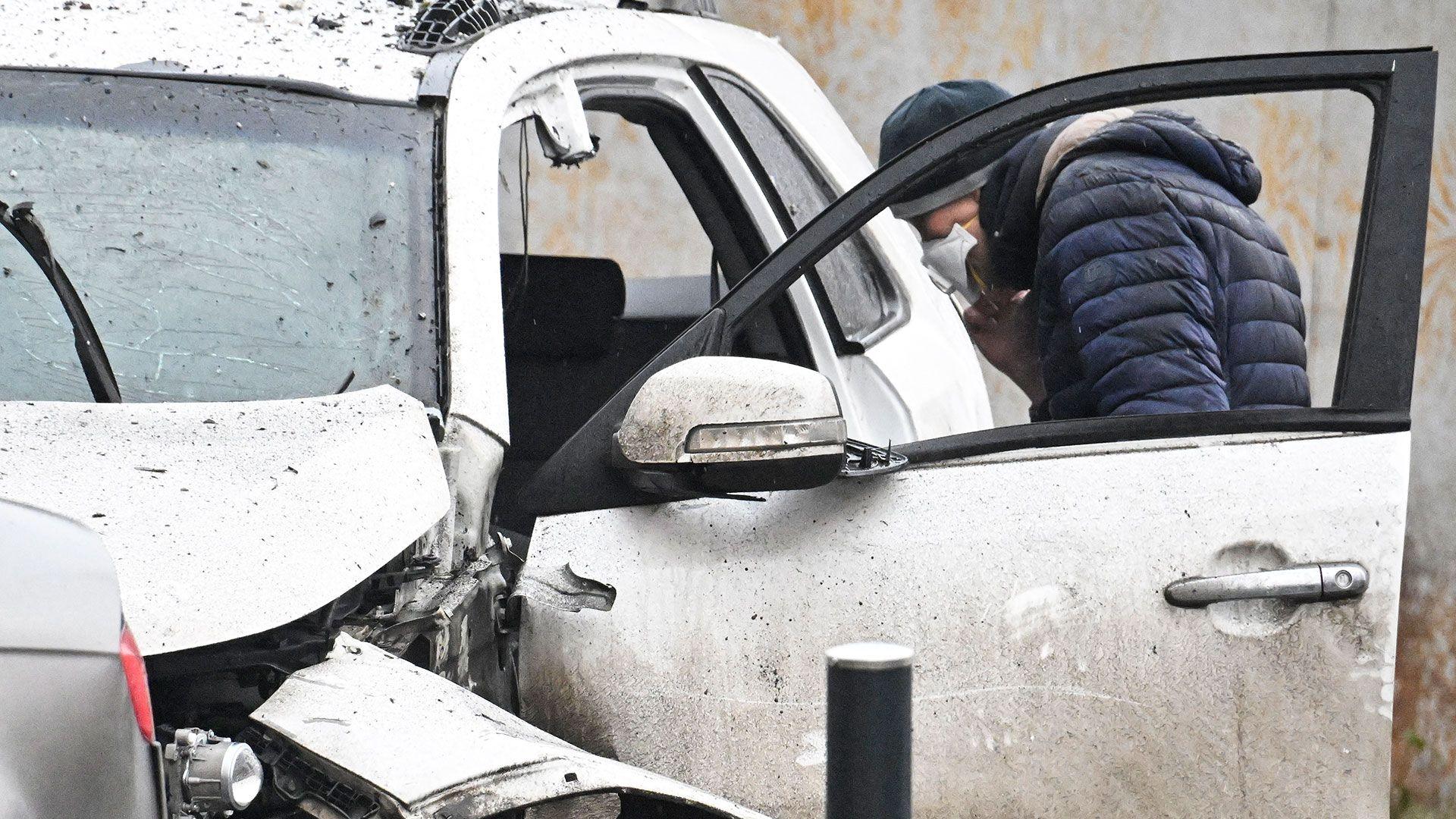 A blurred view of a damaged Moscow vehicle, hinting at a possible saboteur raid