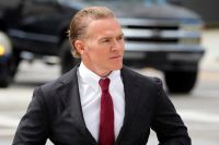 Jordan Goudreau, a former Green Beret, faces arrest after failing to appear in court for a bond hearing related to charges stemming from a failed coup attempt in Venezuela. Testimonies reveal troubling behavior and threats towards a filmmaker who backed his bond.