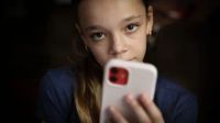 As Australia embarks on a groundbreaking social media ban for children, experts and teens express skepticism over its effectiveness. With creative workarounds already in action, the law faces scrutiny on its viability and implications for youth safety.
