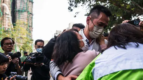 Tragedy Strikes: Hong Kong High-Rise Fire Leaves Families in Agony