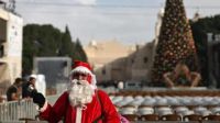 Bethlehem has lit its Christmas tree for the first time since the Gaza war began, signaling a return to festive celebrations after years of turbulence. Mayor Maher Canawati expressed that the decision, though controversial due to the ongoing suffering in Gaza, serves as a beacon of hope. Locals and tourists alike are embracing the festive spirit, longing for the return of peace and prosperity in the region.