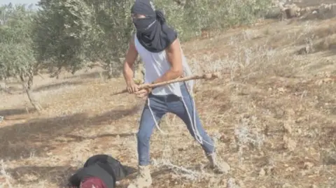 Brutal Assault: Masked Israeli Settler Clubs Palestinian Woman in West Bank