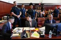 Luigi Mangione appears in court as he fights to exclude incriminating evidence related to the murder of Brian Thompson, CEO of UnitedHealthcare, raising questions about the legality of the seizure.
