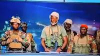A violent coup attempt in Benin has triggered a massive manhunt for soldiers who declared a takeover on national television, leading to hostages being taken. President Patrice Talon asserts that the situation is under control.